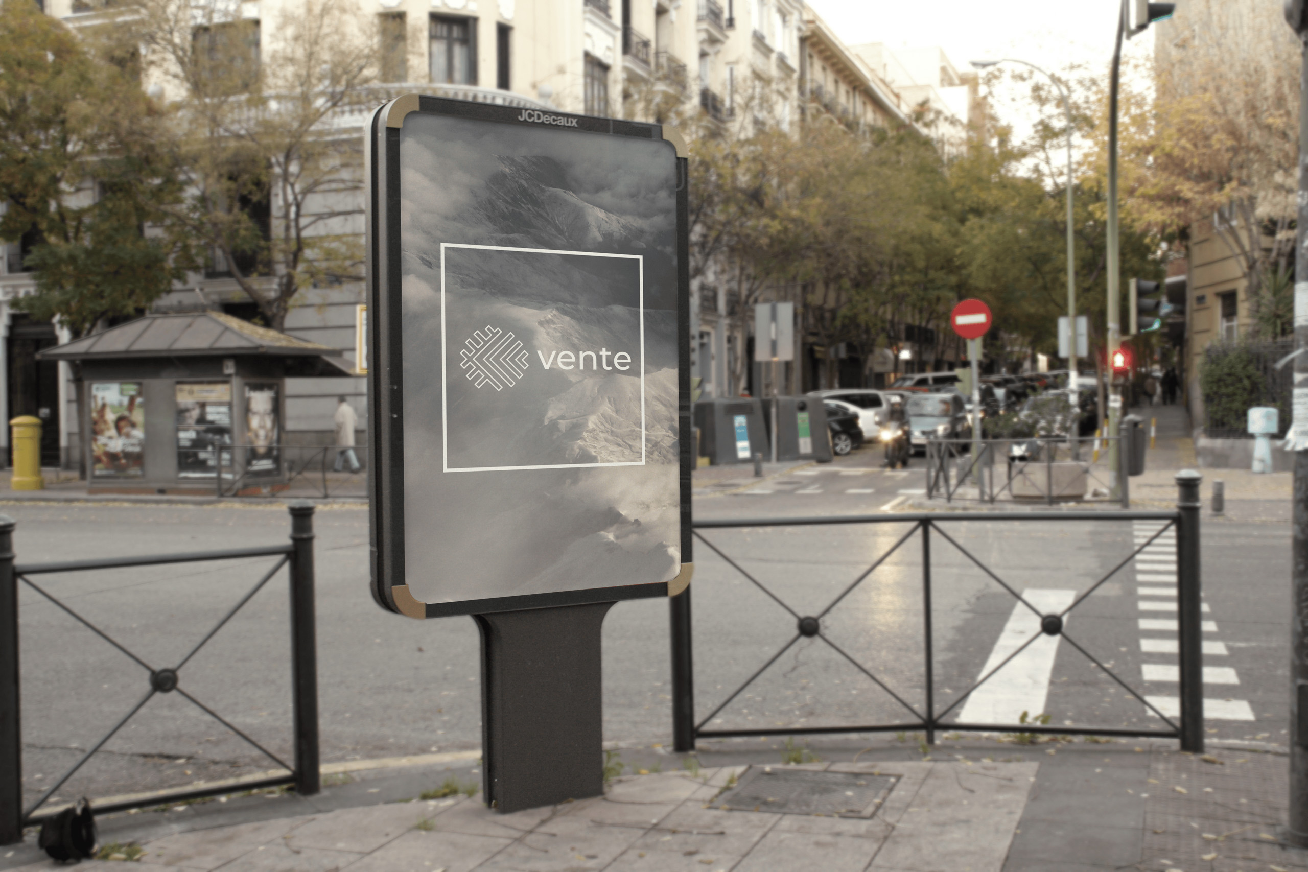 A photo of a sign on a city street corner displaying mockup of Vente logo. 